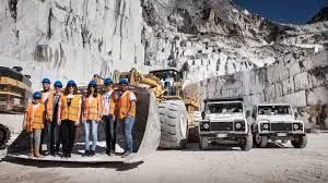 Quarry workers and machinery in the Carrara marble quarries