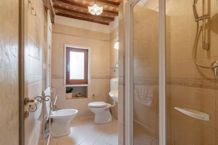 Ensuite bathroom with shower and window at Podere Settefrati farmhouse