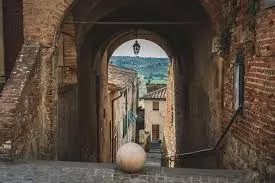 Medieval stone archway in the historic centre of Peccioli