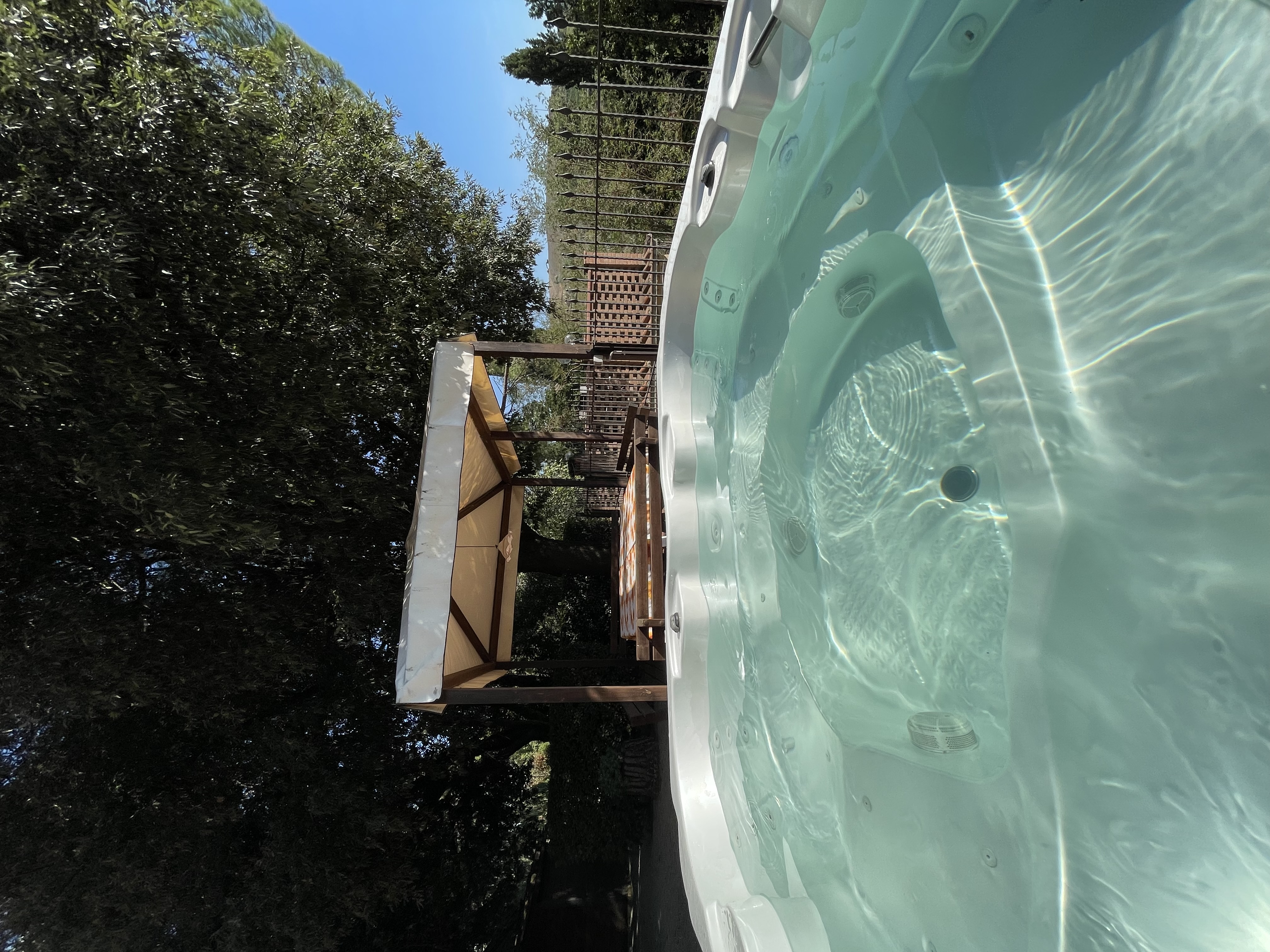 Pool at dusk with lights at Podere Settefrati