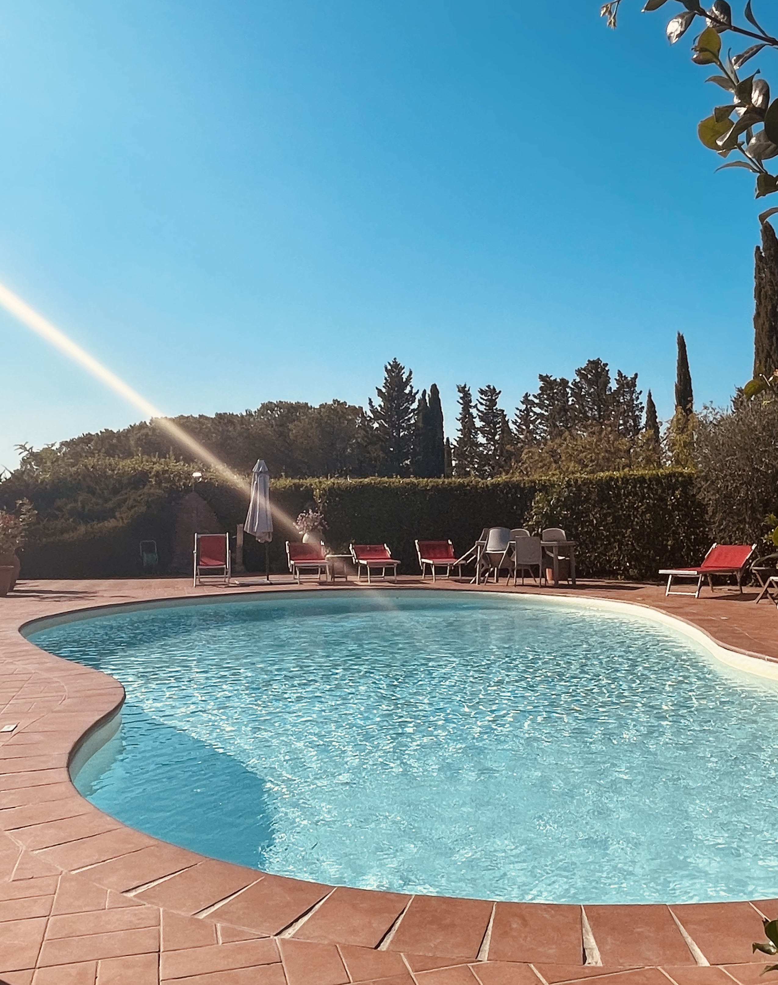 Reflection of the farmhouse on the pool water at Podere Settefrati